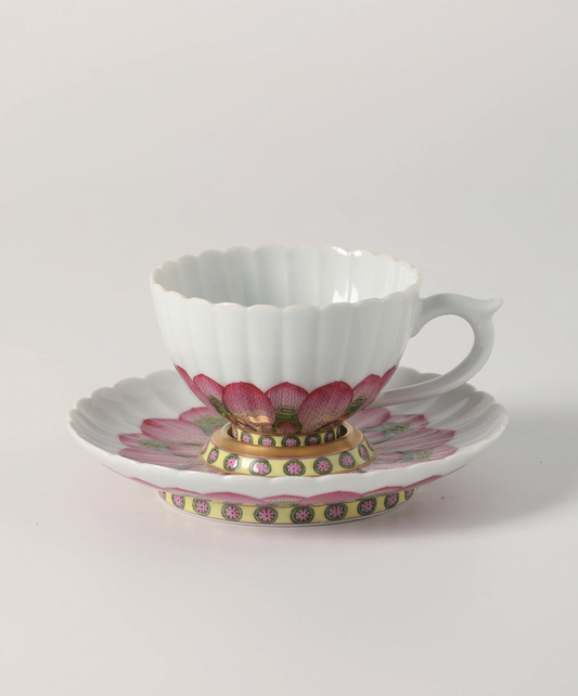 a Famille Rose Coffee Cup And Saucer Painted With Designs Of Twin Lotusflowers